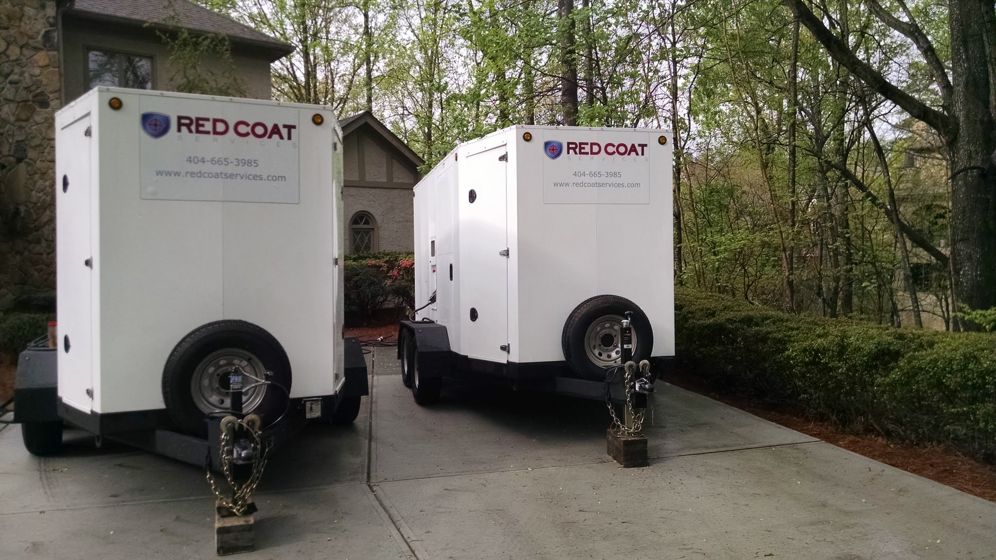 Red Coat trailers parked in a driveway